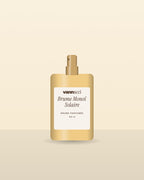 Brume Monoï Solaire Vannucci, flacon vaporisateur sur fond clair